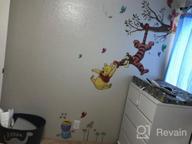 img 1 attached to Sweeten Your Walls With RoomMates Winnie The Pooh Swinging For Honey Wall Decals! review by Thong Pilla