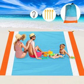 img 4 attached to Aitey Waterproof Sand-Free Beach Blanket - Compact Outdoor Mat For Picnic, Travel, Hiking, Camping, And Music Festivals. Includes 4 Stakes, 4 Corner Pockets, And A Carry Bag - 82"X 79" In Blue.