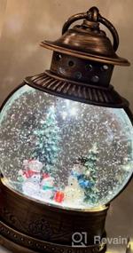 img 8 attached to Christmas Magic In A Lantern: Musical And Lighted Snow Globe For Home Decor And Gifting