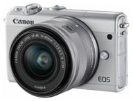 camera canon eos m100 kit 15-45mm is stm lp-e12, white логотип