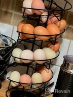 img 1 attached to Toplife Spiral Design Metal Egg Skelter Dispenser Rack: Stylish Storage & Display Solution In White review by Kevin Ballard