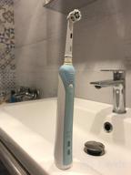 img 1 attached to Oral-B Pro 570 CrossAction, white-blue review by Anastazja Chteinman ᠌