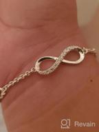 img 1 attached to 💎 ELEGANZIA Sterling Silver Infinity Bracelet for Women and Girls with Cubic Zirconia, Adjustable Love Heart Charm Bracelet - Elegant Jewelry review by Omar Gonzales