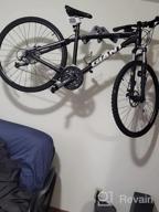 img 1 attached to Vibrelli Bike Wall Mount: Horizontal Storage Rack For Hanging Bicycles In Home Or Garage - Adjustable Hooks For Mountain, Road & Hybrid Bikes review by Tim Jolivette