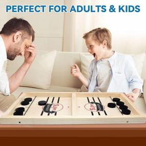 img 2 attached to BAKAM Portable Table Hockey Game - Super Fast Sling Puck Game For Family Game Night Fun. Tabletop Slingshot Games Toy For Boys, Girls And Adults. Desktop Sport Board Game With Large Winner Design.