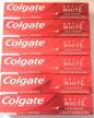 colgate toothpaste optic white fighter logo