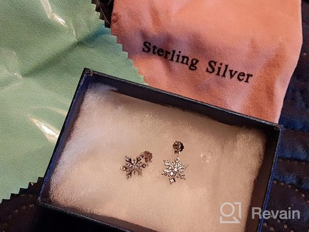 img 1 attached to Shimmering Winter Magic: EleQueen 925 Sterling Silver Snowflake Stud Earrings With Cubic Zirconia review by Joy Berry