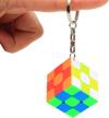 compact and colorful 3x3 rubik's cube keychain for speedcubing and magic shows - stickerless and fast miniature cube by cuberspeed logo
