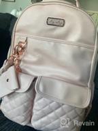 img 1 attached to Large Capacity Itzy Ritzy Diaper Bag Backpack - Bottle Pockets, Changing Pad, Stroller Clips & Comfy Straps! review by Milagros Iser