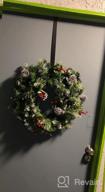 img 1 attached to SHareconn 24 Inch Prelit Artificial Christmas Wreath With 15" Hanger, Multi-Color Lights With Timer By Batteries Operated, Pine Cones And Red Berries For Front Door Wall Windows Xmas Decoration,Snow review by Jason Bell
