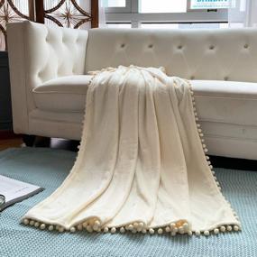 img 2 attached to Stay Cozy All Year Long With LOMAO Flannel Blanket - Pompom Fringe, Lightweight & Perfect For Your Bed, Couch Or Sofa (Ivory, 51''X 63'')