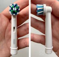 img 2 attached to 💪 White Oral-B Vitality Electric Toothbrush with FlossAction for Improved Oral Health review by Ahmad ᠌