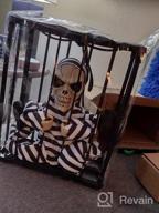 img 1 attached to Halloween Animatronic Talking Prisoner Decoration With Motion Sensor And Light - Spooky Indoor/Outdoor Prop For Kids And Adults | Clearance Halloween Décor review by Michael Domus