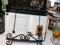 img 1 attached to MyGift Black Metal Cookbook Stand For Kitchen Counter, Cookbook Easel Stand With Weighted Page Holder And Vintage Scrollwork Design review by Darryl Wheeler