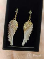 картинка 1 прикреплена к отзыву Szxc Women'S Crystal Guardian Angel Wings Hypoallergenic Dangle Earrings Biker Jewelry 2.25 Inches от Oscar Berry