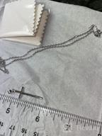 картинка 1 прикреплена к отзыву Мужское крестное ожерелье из нержавеющей стали с подвеской нацы Strength Bible Verse - ожерелья XOYOYZU для мальчиков от Brian Weese