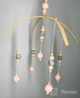 img 1 attached to Rotating Wooden Crib Mobile With Nut And Bead Accents For Baby Girls' Ceiling Nursery Décor review by Amy Miller