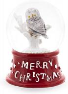 charming mini snow globe: white owl perched on tree against red base logo