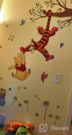 img 1 attached to Sweeten Your Walls With RoomMates Winnie The Pooh Swinging For Honey Wall Decals! review by Michael Miner
