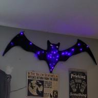 transform your lawn and garden with peiduo's halloween giant bat wings decoration! logo
