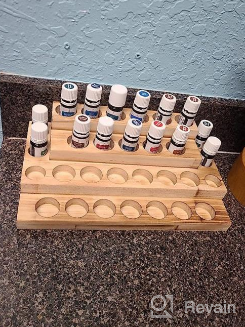 img 1 attached to Organize And Display Your Essential Oils With LIANTRAL'S 3-Tier Rack In Rustic Burnt Wood Design review by Brando Carpenter