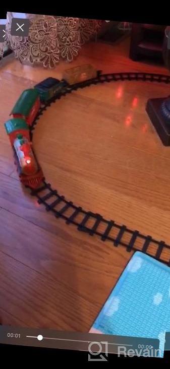 img 1 attached to Experience The Magic Of The Holidays With PUSITI Classic Christmas Train Set - Battery Operated Locomotive Engine And 11.5 Ft Tracks With Lights And Sounds For Kids' Delight review by Nate Eich