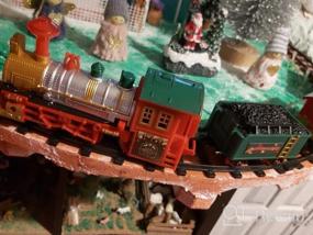 img 5 attached to Классический рождественский поезд с фарами, реалистичными звуками, 4 вагонами и гусеницами - идеальный подарок для рождественского декора под елкой - DeAO Train Set