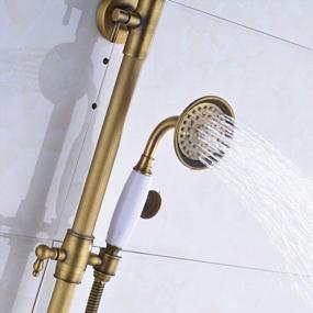 img 1 attached to Vintage Charm Meets Modern Functionality: Rozin Antique Brass Shower Faucet Set With Dual Handles, Bathtub Rainfall Shower Fixture, And Hand Shower