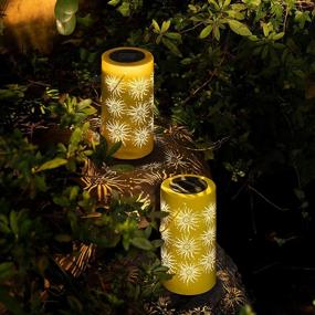 img 4 attached to 2 Pack Solpex Solar Hanging Lantern Outdoor Garden Decor Sun Patterns LED Lights For Patio, Lawn, Yard, Tree & Table - Yellow