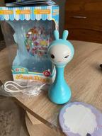 img 1 attached to 🎶 Blue Alilo Smarty Bunny Shake & Tell Musical Toy Rattle for Newborns and Infants - Soother with Lullaby Song Story, Music Player & Games review by Anastazja Pluta ᠌