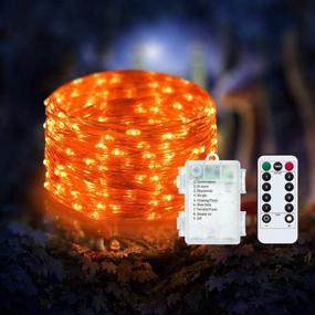 img 4 attached to 33Ft 100 LED Waterproof Orange Halloween String Lights - Battery Operated Firefly Lights With Remote Control Timer, 8 Modes For Decorative Christmas And Halloween Lighting By ANJAYLIA