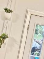 img 1 attached to Modern And Chic: Set Of 3 Ceramic White Hanging Planters With Jute Rope For Indoor Succulent Plants review by Kristen Moore