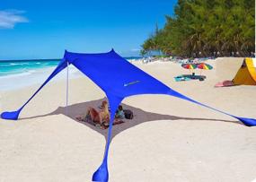 img 4 attached to AMMSUN Beach Tent With Sandbag Anchors, Portable Canopy Sun Shelter,7 X 7Ft -Lightweight, 100% Lycra SunShelter With UV Protection. Sunshade For Family At The Beach, Camping & Outdoor (Dark Blue)