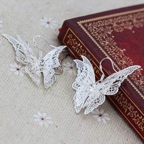 img 1 attached to Comelyjewel Women'S Silver Plated Filigree Butterfly Drop Dangle Hook Earrings (Filigree Butterfly)