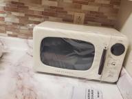 img 1 attached to Winia WOR07R3ZEL 0.7 Cu. Ft Retro Microwave, City Blue review by Nicole Reed