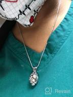 img 1 attached to Lotus Flower Shaped Cremation Jewelry Urn Pendant Necklace for Ashes review by Jana Bramlage