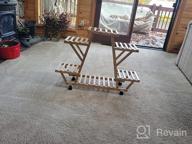 картинка 1 прикреплена к отзыву Bamboo 6 Tier Rolling Plant Stand - Stylish Indoor/Outdoor Planter Display Rack For Your Patio Or Living Room от Ryan Huhn