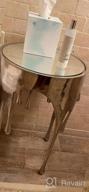 img 1 attached to Stylish Aluminum Drip Accent Table With Melting Designed Legs And Shaded Glass Top review by Marci Estrada