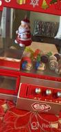 картинка 1 прикреплена к отзыву Christmas Themed Vending Machine Dispenser With 30 Reusable Tokens For Toys, Candy & Prizes - Bundaloo Santa Claw Arcade Game Holiday & Birthday Gift For Kids от Francisco Duncan