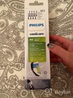 img 1 attached to 💎 Set of 4 Philips Sonicare HX6064/10 Best White W2 Brush Heads with BrushSync for Effective Teeth Whitening review by A Eh Khung ᠌