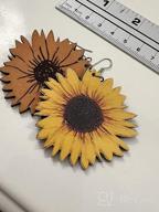 картинка 1 прикреплена к отзыву Серьги солнечного цветка из дерева "Handmade 3D Wooden Sunflower Drop Earrings: Bohemian Dangle Jewelry for Women & Girls от Tracy Wilcox