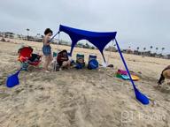 img 1 attached to AMMSUN Beach Tent With Sandbag Anchors, Portable Canopy Sun Shelter,7 X 7Ft -Lightweight, 100% Lycra SunShelter With UV Protection. Sunshade For Family At The Beach, Camping & Outdoor (Dark Blue) review by Ray Adair