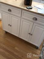 img 1 attached to White Rolling Kitchen Island Cart With Drop-Leaf, Rubber Wood Countertop, Storage Drawers, And Door Cabinets From HOMCOM review by Andrew Smith