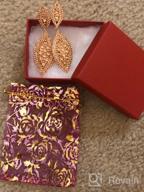 картинка 1 прикреплена к отзыву Sparkling Elegance: Flyonce Women'S Rhinestone Crystal 2 Leaf Chandelier Earrings For Weddings And Special Occasions от Kristen Gray