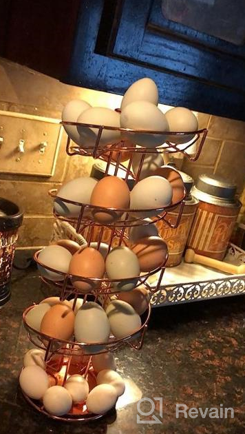 img 1 attached to Toplife Spiral Design Metal Egg Skelter Dispenser Rack: Stylish Storage & Display Solution In White review by Matthew Bell