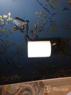 img 1 attached to Black Wall-Mounted Metal Toilet Paper Holder With Ceramic Bird And Roll Organizer For Bathroom By OwlGift review by Fred Griffin