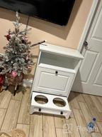 img 1 attached to Stylish White Farmhouse Pet Station With Pull Out Bowls & Storage Cabinet For Modern Pet Care review by Tony Korek