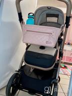 img 1 attached to Organize Your Stroller With Itzy Ritzy Adjustable Caddy - 2 Built-In Pockets, Front Zipper & Fits Most Strollers! review by Katie Burgeson