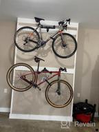 img 1 attached to Vibrelli Bike Wall Mount: Horizontal Storage Rack For Hanging Bicycles In Home Or Garage - Adjustable Hooks For Mountain, Road & Hybrid Bikes review by Francisco Duncan