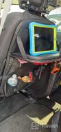 картинка 1 прикреплена к отзыву Tsumbay Car Backseat Organizer - PU Leather With Tablet Holder, Foldable Table Tray, And 9 Storage Pockets от Kip Robinson